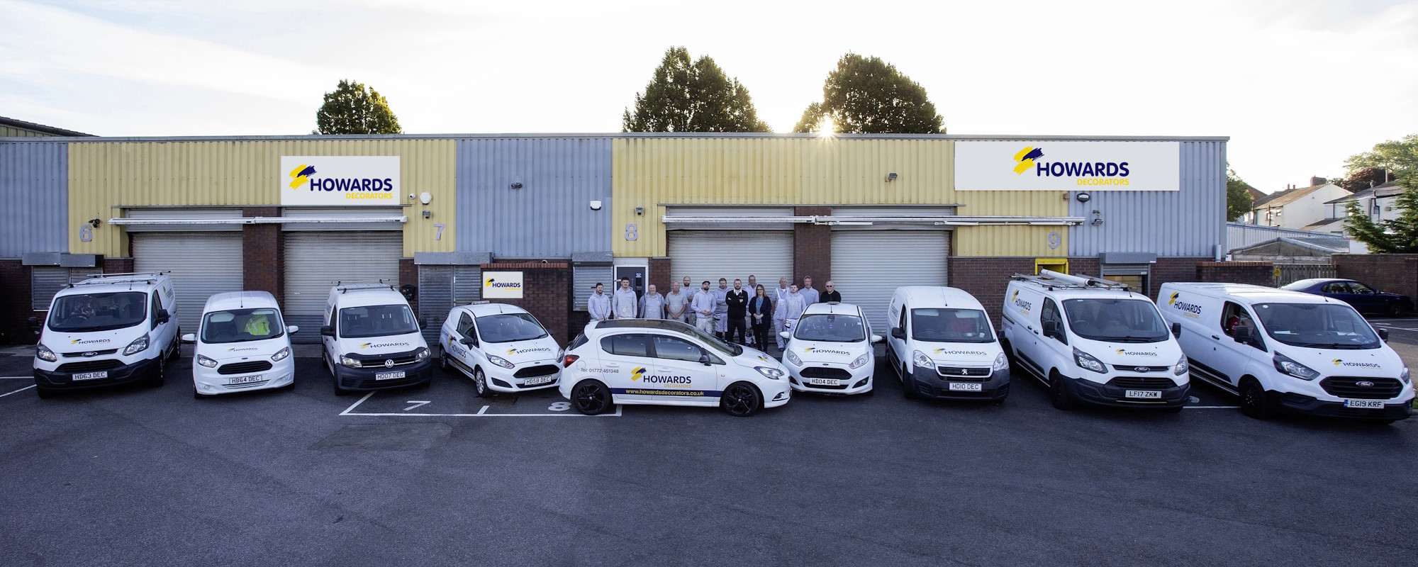 Howards Decorators team and branded vans outside Units 6 to 9 on the industrial estate